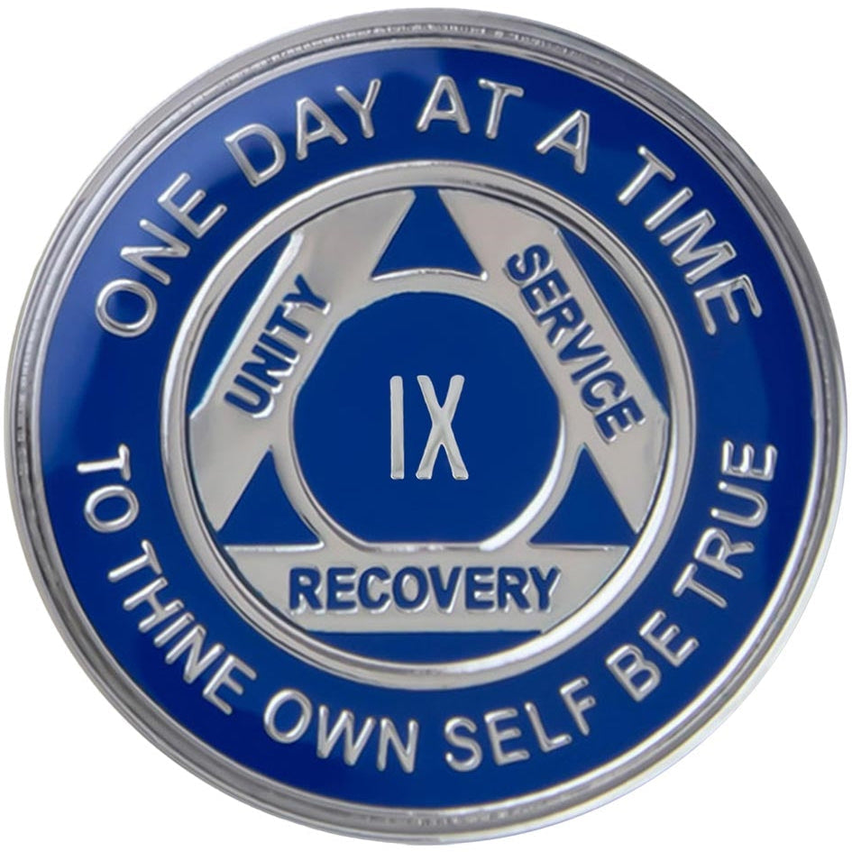 A blue and gold AA (Alcoholics Anonymous) recovery coin on a white background.