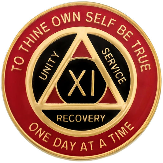 A blue and gold AA (Alcoholics Anonymous) recovery coin on a white background.